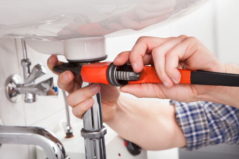 Emergency plumber attending a job in Borehamwood